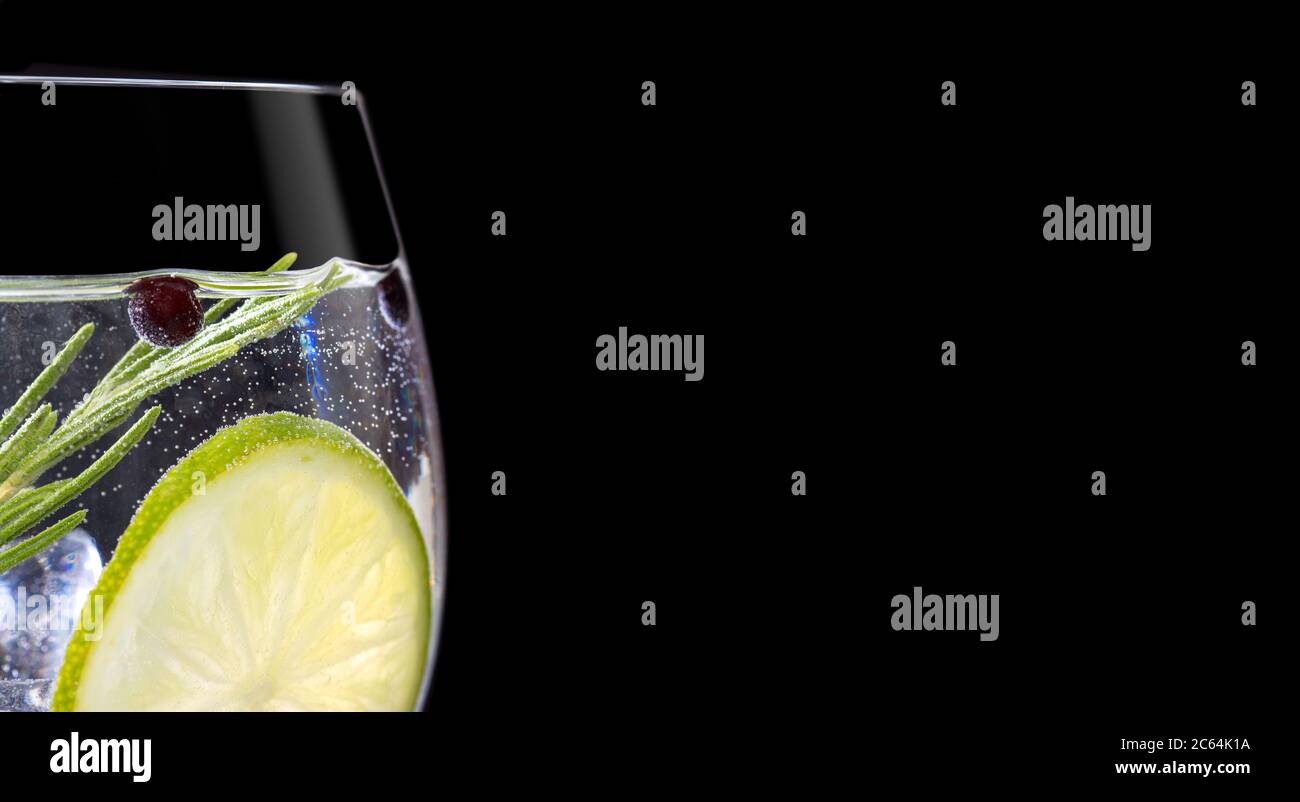 Close up of gin tonic glass on black background Stock Photo