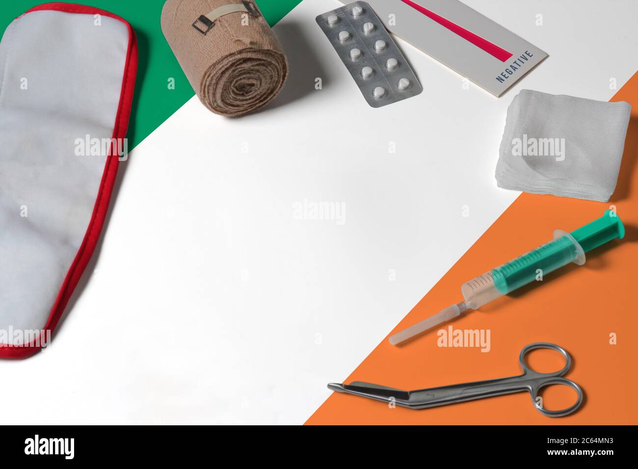 Ireland flag with first aid medical kit on wooden table background