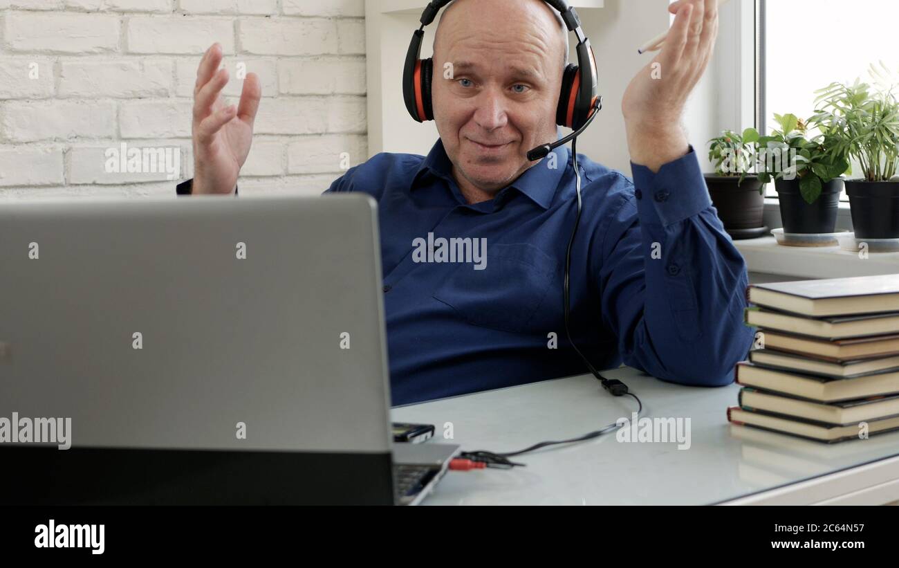 Man Working Remote from Home Using Laptop Connection Stock Photo