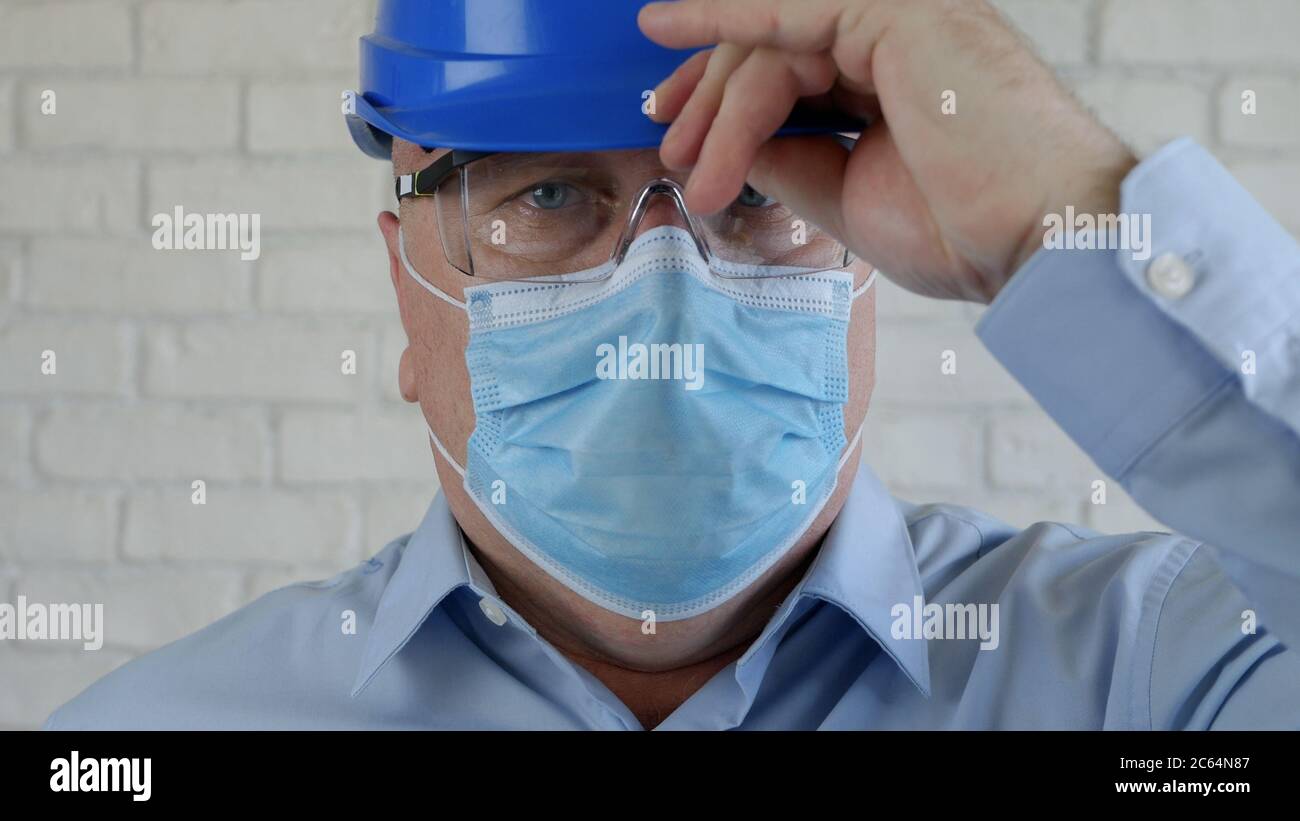 Confident Image with an Engineer Wearing Face Protection Mask Against Viruses. Stock Photo