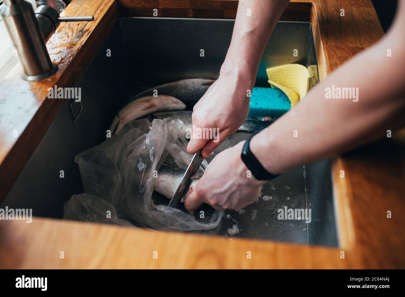 Fish preparation sink hires stock photography and images Alamy