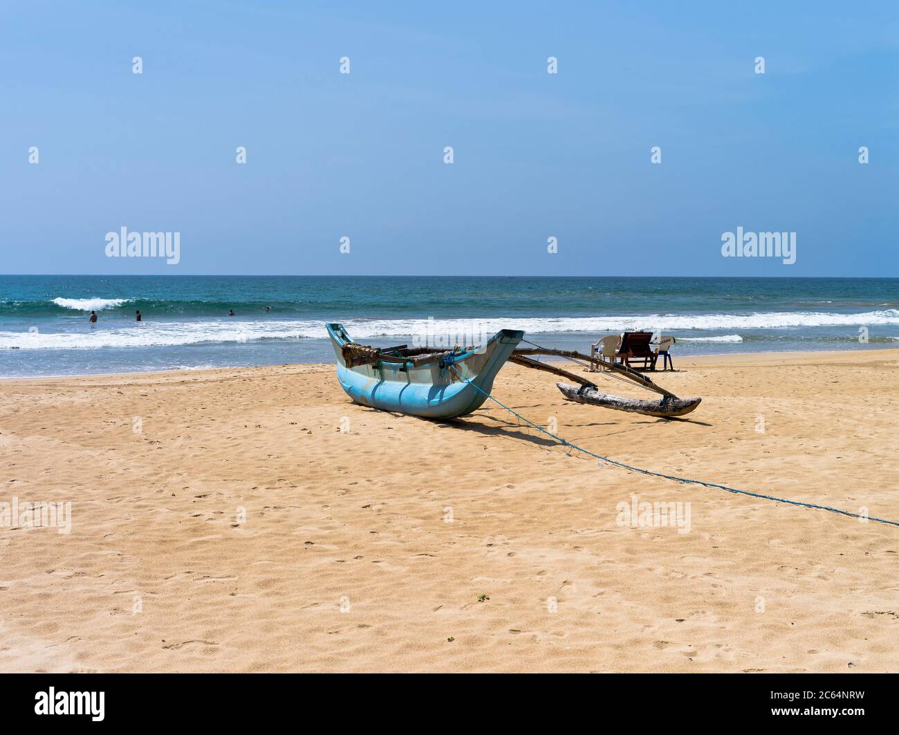 dh Robolgoda Beach Galle Road BENTOTA SRI LANKA Sri Lankan West coast hotel beaches traditional outrigger canoe fishing boat shore Stock Photo