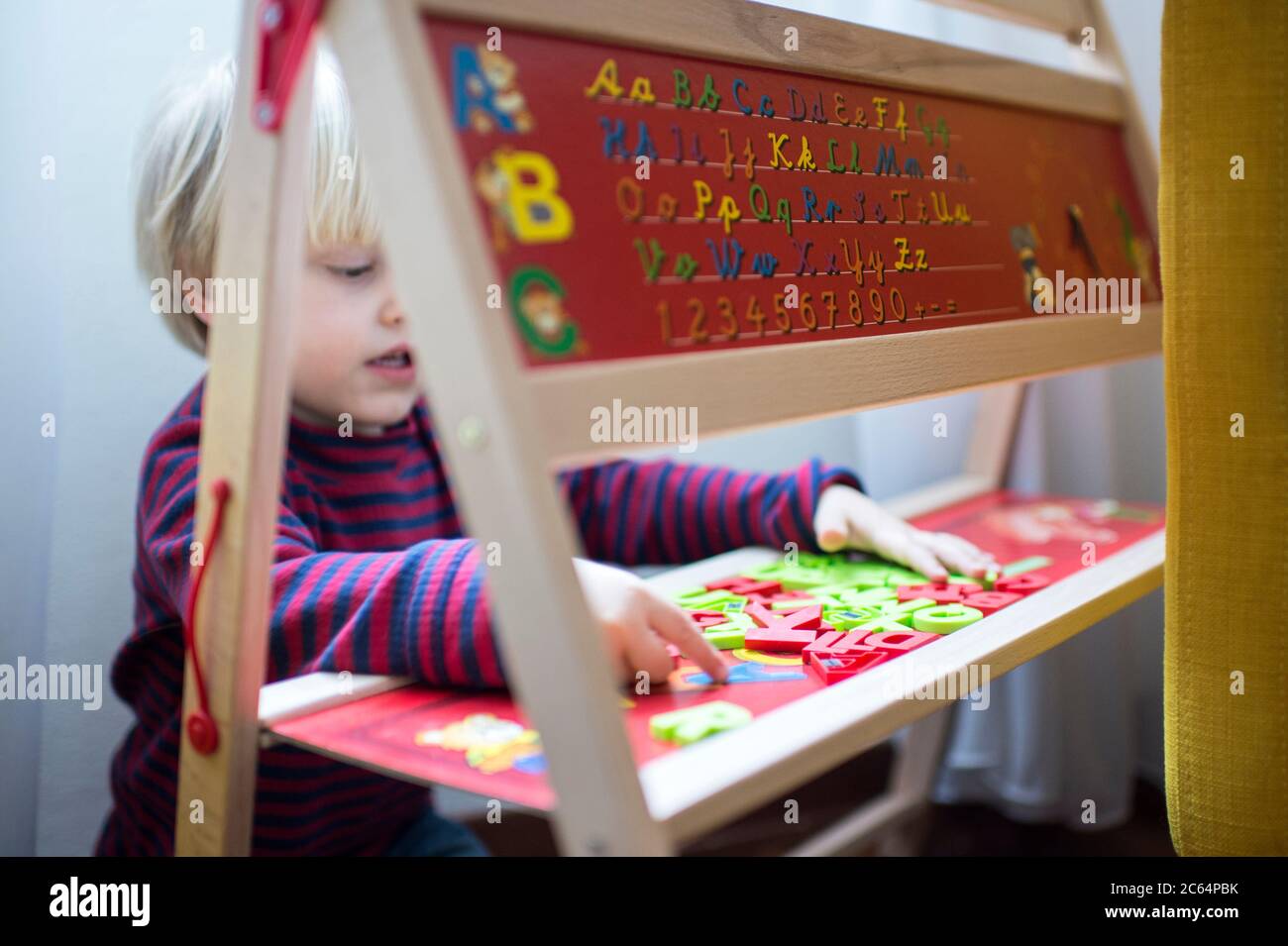 Child playing at home Stock Photo