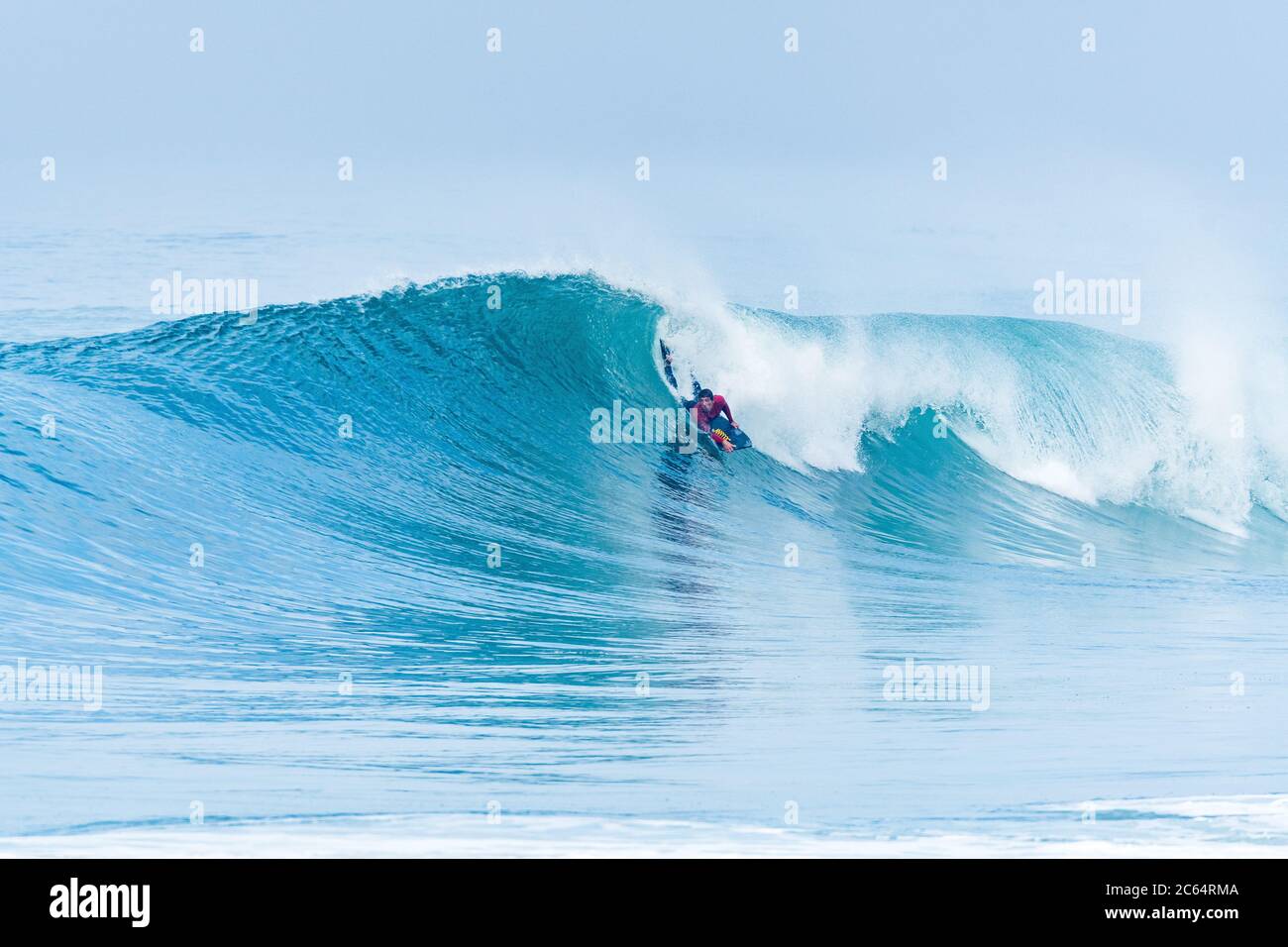 Bodyboarder surfing ocean wave on a sunny day Stock Photo - Alamy
