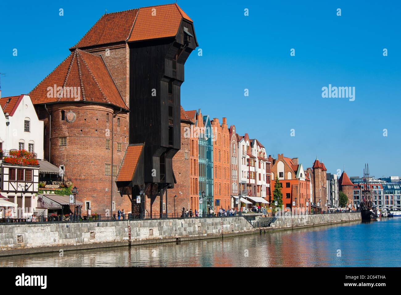 Gdansk, Poland - September 2015: Sunny views along the waterfront of Gdansk with the Zuraw (Giant Crane) against clear blue sky Stock Photo