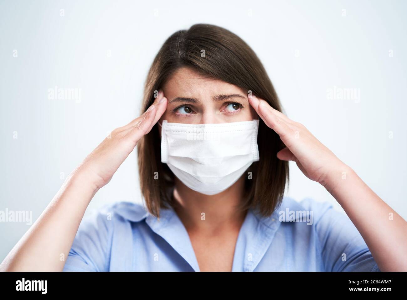 Woman headache wearing face mask hi-res stock photography and images ...