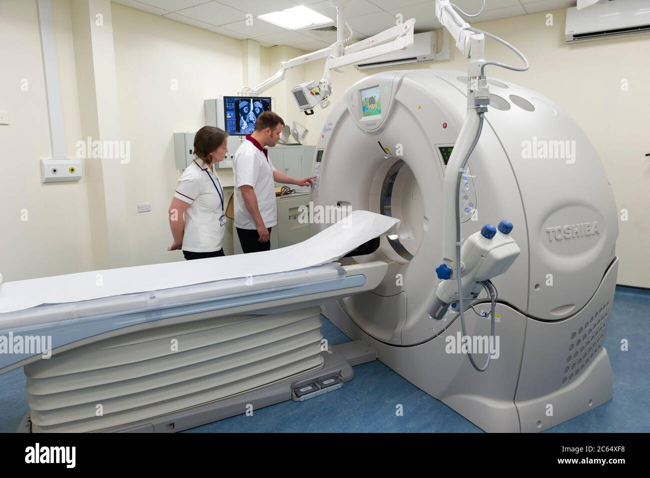 A CT Scanner in a hospital department. A computerized tomography scan (CT or CAT scan) uses computers and rotating X-ray machines Stock Photo