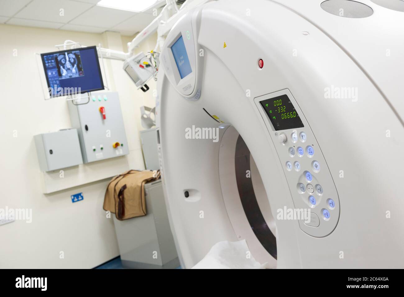 A CT Scanner in a hospital department. A computerized tomography scan (CT or CAT scan) uses computers and rotating X-ray machines Stock Photo