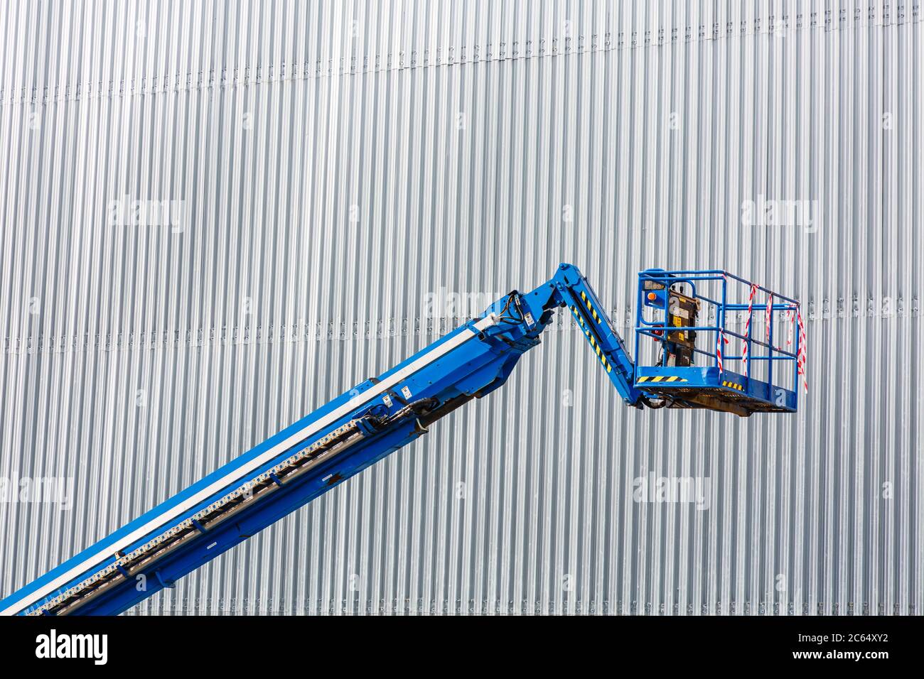 Cherry picker / hydraulic platform hoist / hydraulic lift on a construction site, Scotland, UK Stock Photo