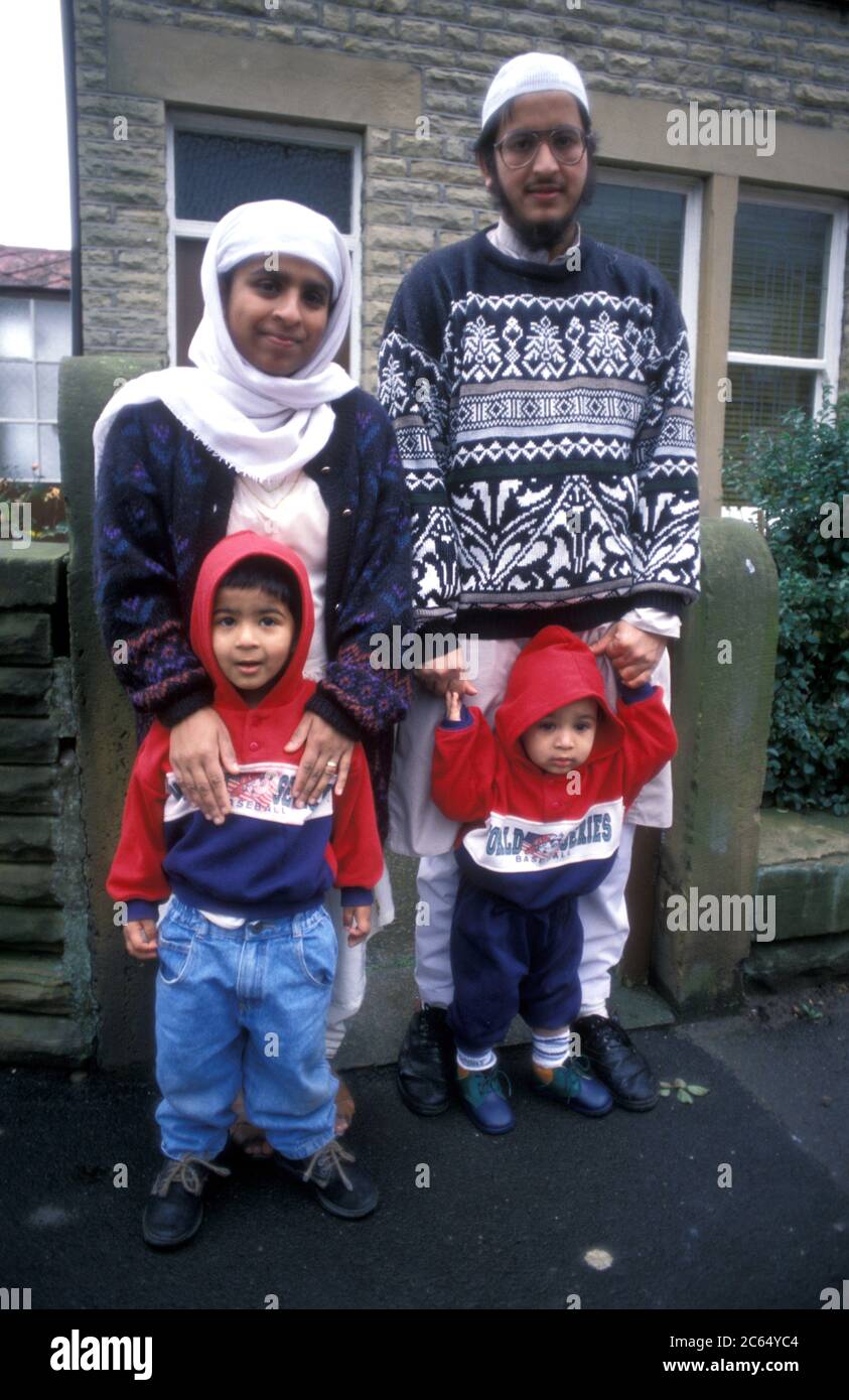 Asian family outside their house; Yorkshire UK Stock Photo
