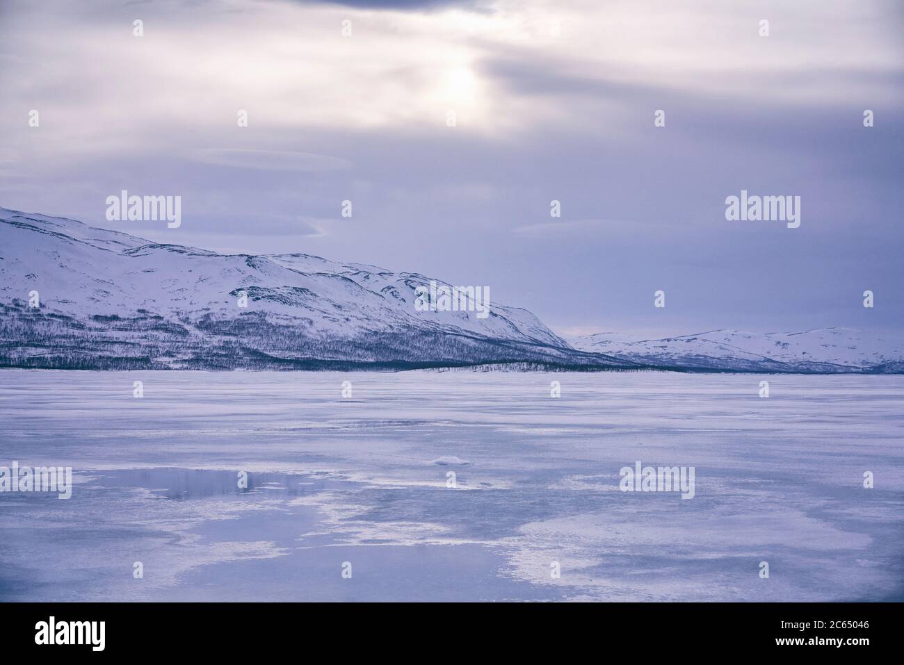 View across a frozen lake in Vasterbottens Lan, Sweden. Stock Photo