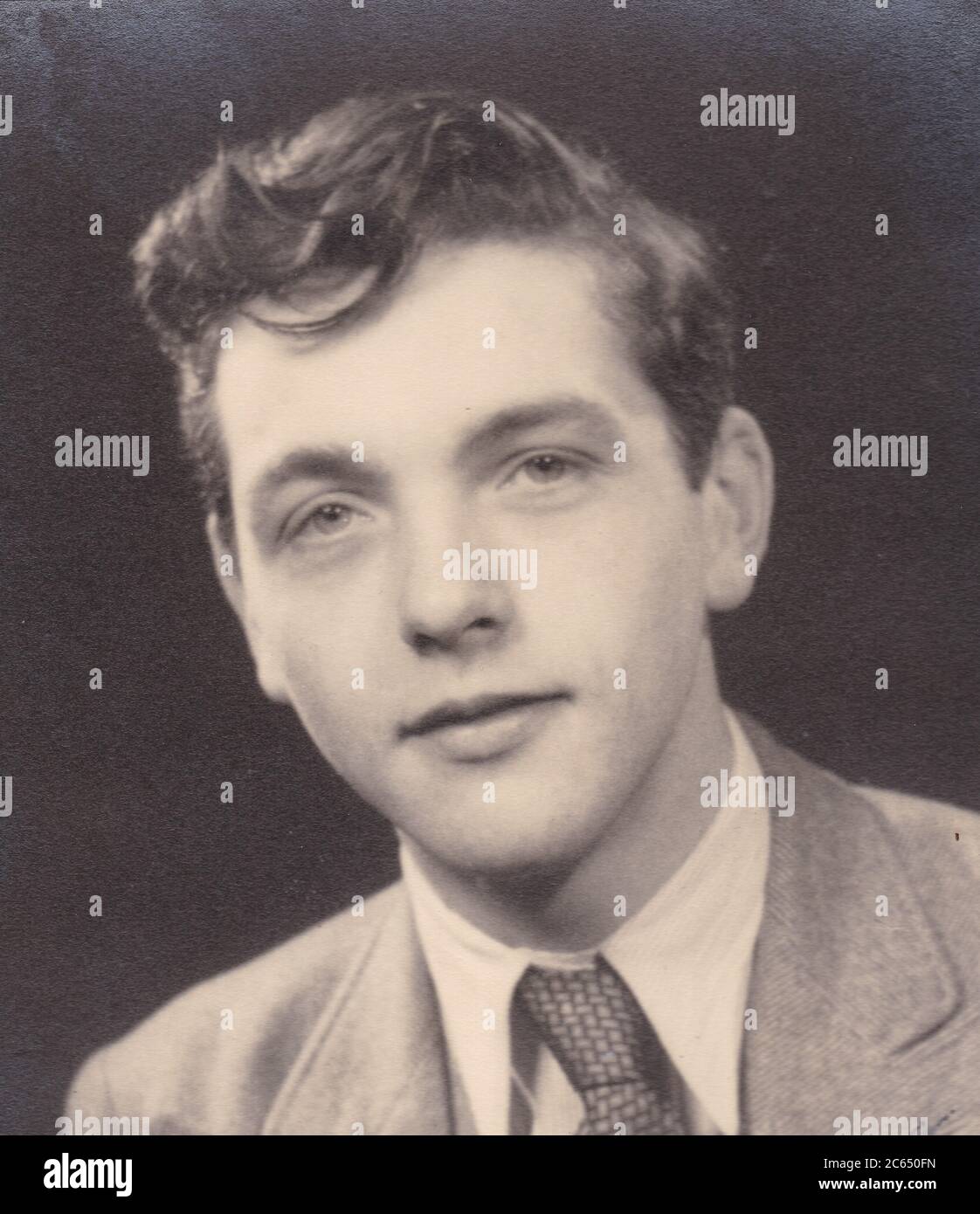 Vintage black and white portrait photo of a handsome young man 1940s. Stock Photo