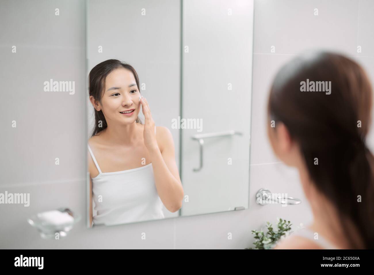 Young girl washing her face with soap Stock Photo Alamy