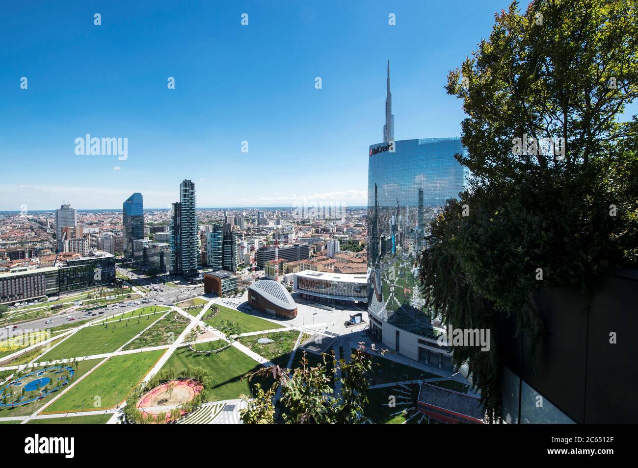 Italy, Lombardy, Milan, cityscape with Unicredit Tower and Biblioteca degli Alberi Park Stock Photo