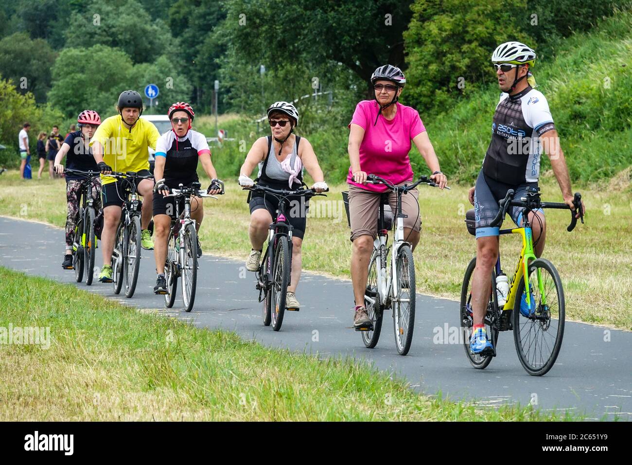 Group of people cycling holidays Germany Saxony Germany, Europe People Riding Bikes on Cycle path Bicycle path Cycle, Bike trail Cyclists Germany Stock Photo