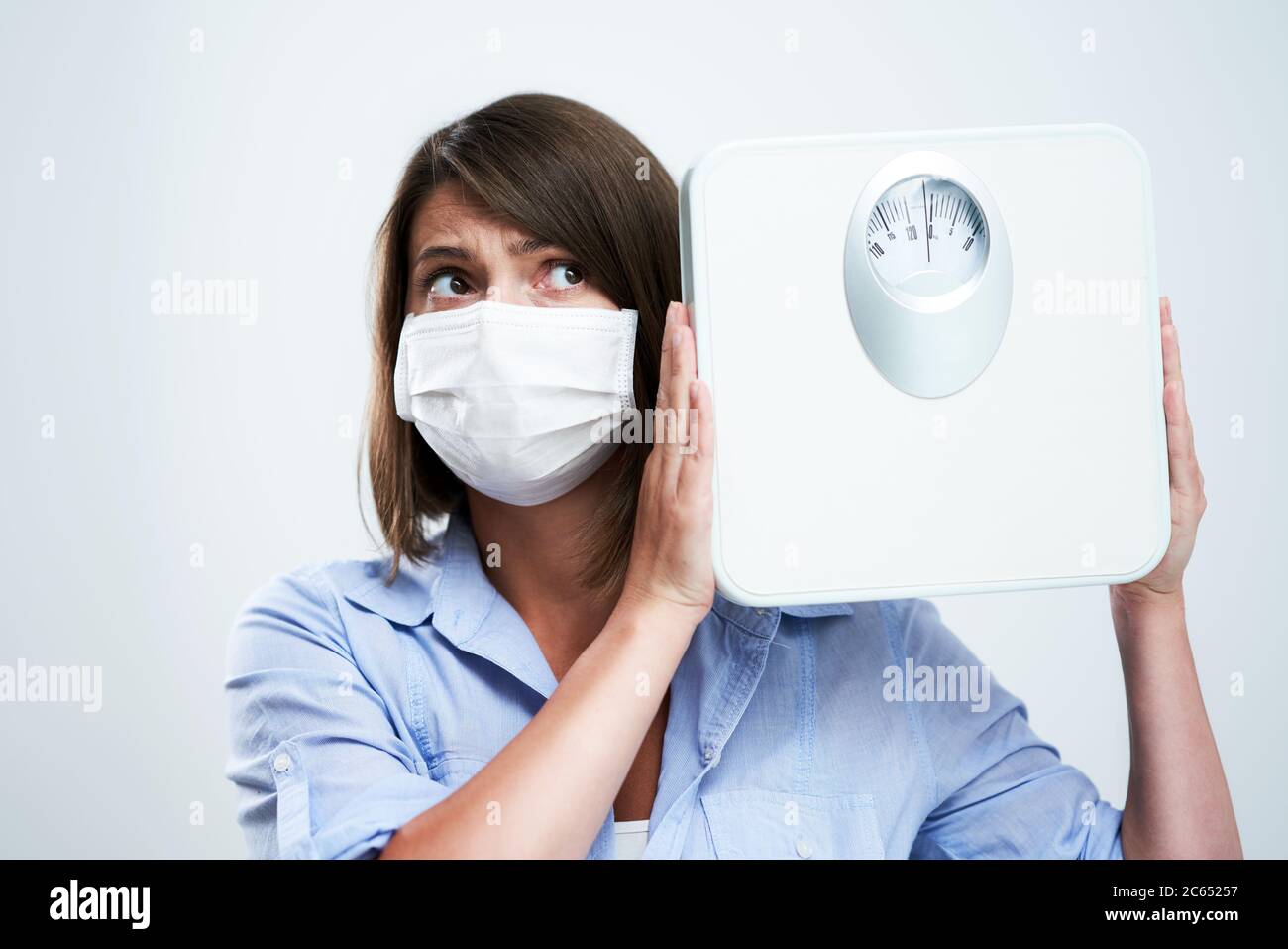 Woman put on face protective hi-res stock photography and images - Alamy