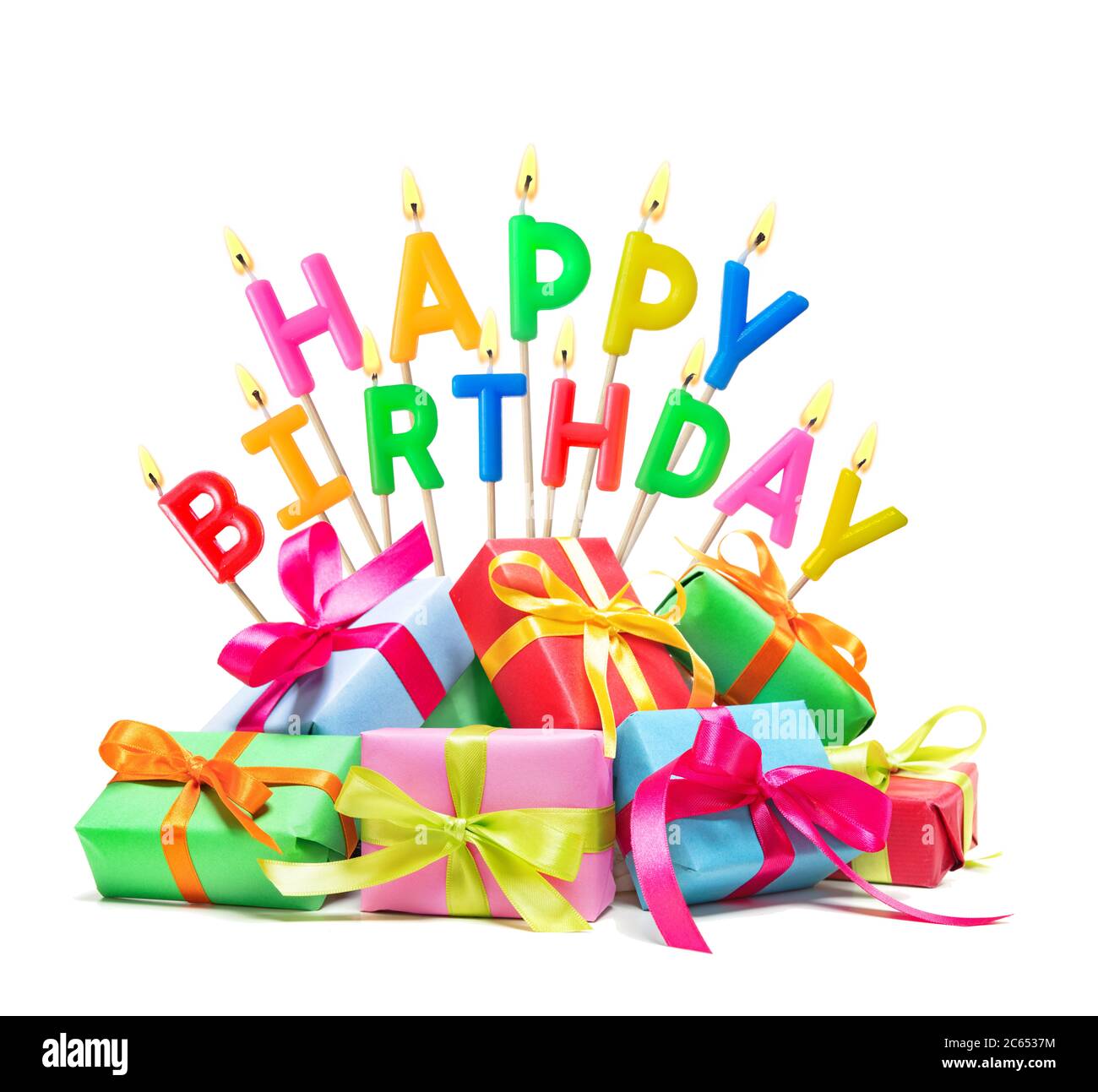 Burning happy birthday candles with gift boxes isolated on white