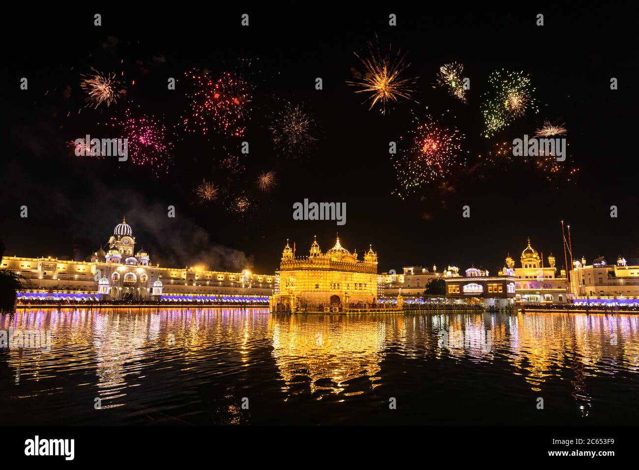 Golden Temple Amritsar lit by Diya and fire crackers Guru Purab festival and Diwali Stock Photo