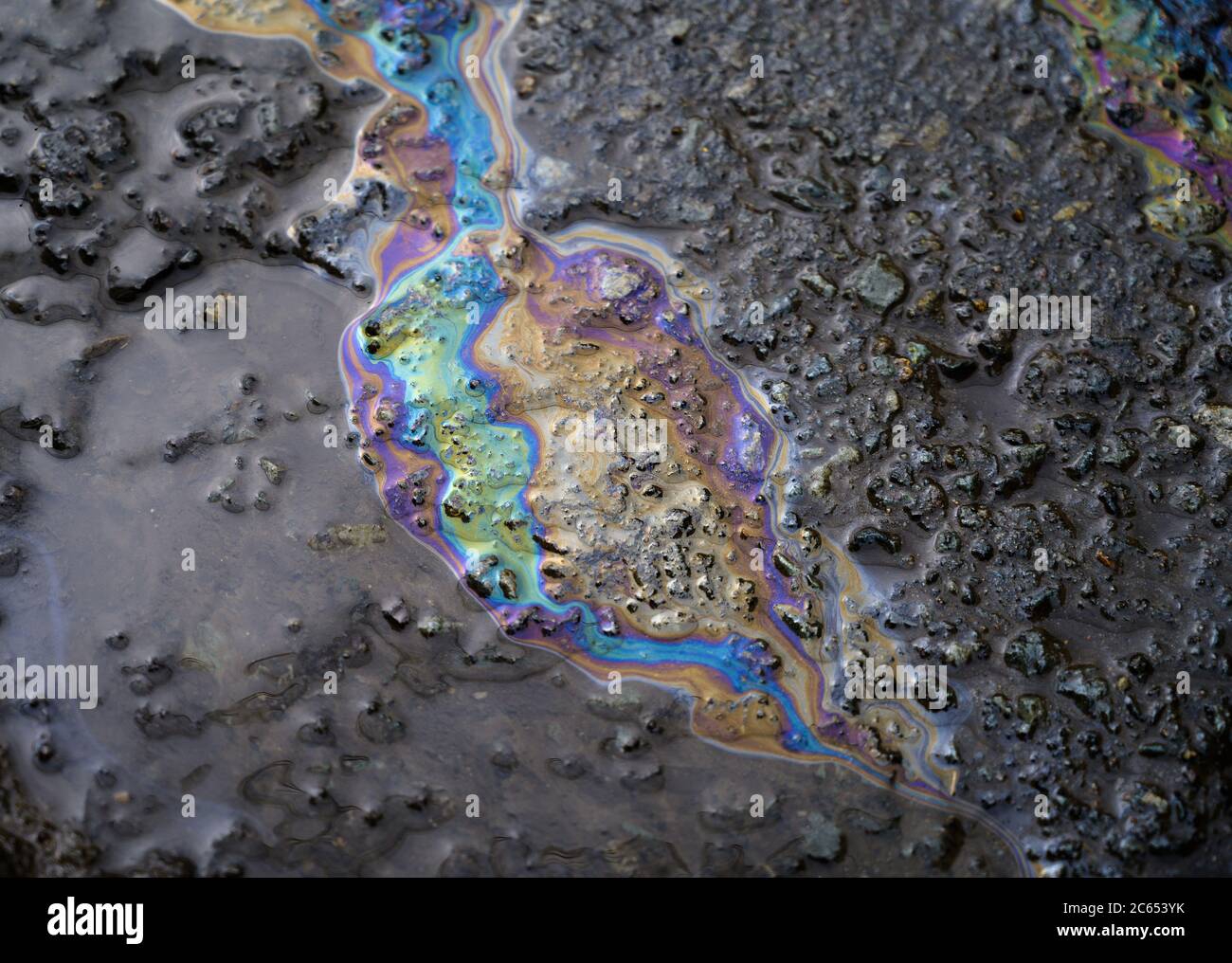 Gasoline flows on the pavement. Stock Photo