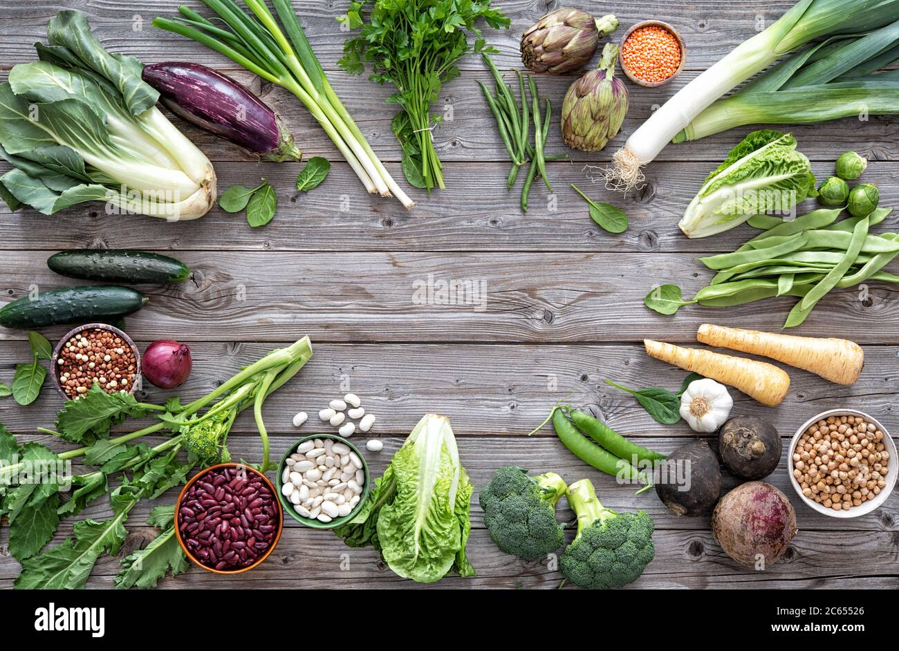 Assortment of fresh organic vegetables for healthy eating and diet on the rustic wooden table Stock Photo