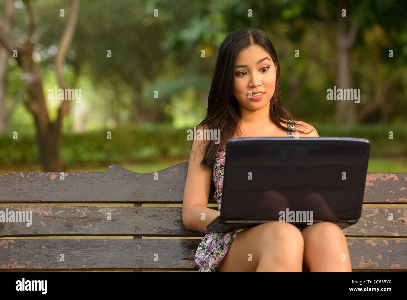 Portrait of young beautiful Asian woman at the park outdoors Stock ...
