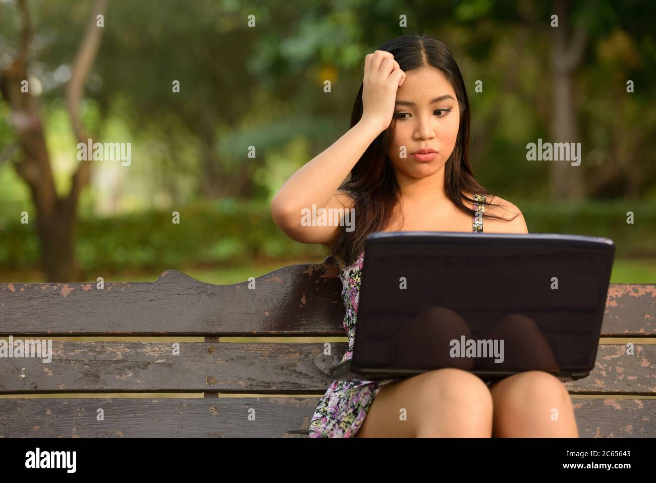 Portrait of young beautiful Asian woman at the park outdoors Stock ...