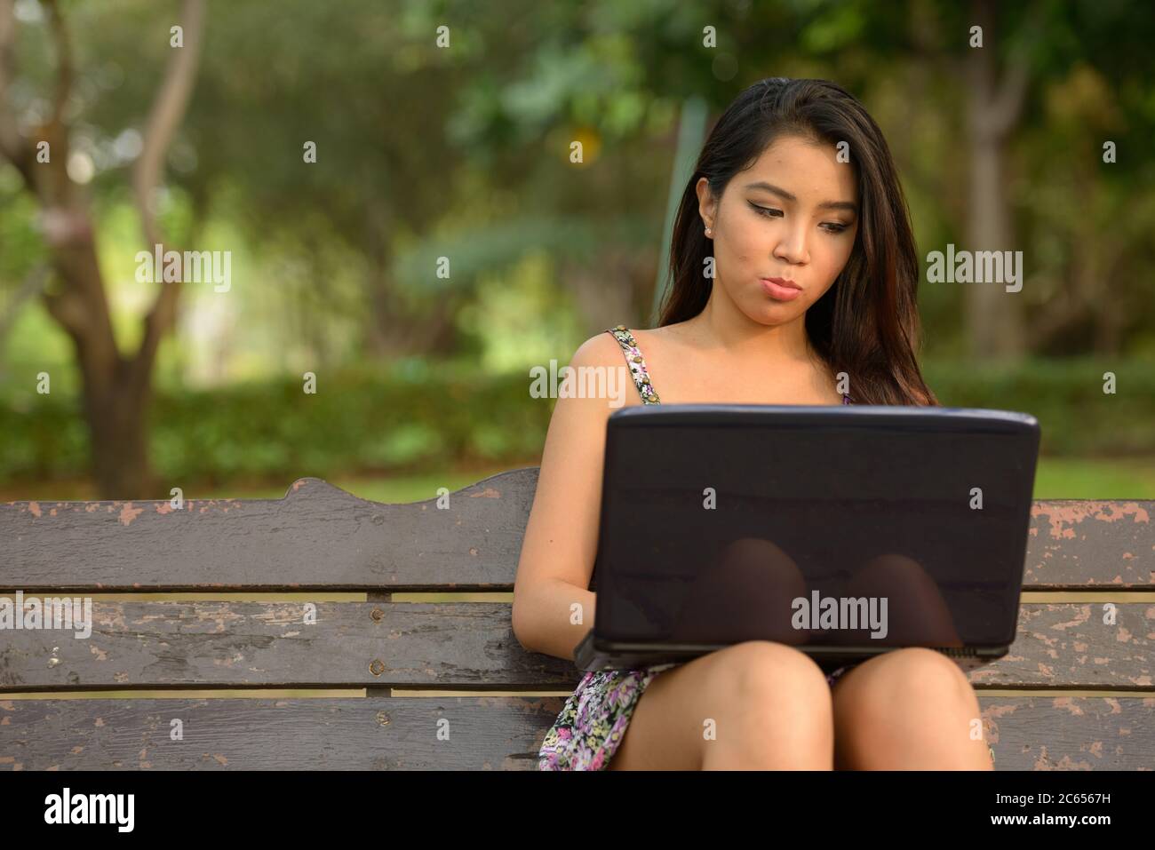 Portrait of young beautiful Asian woman at the park outdoors Stock ...