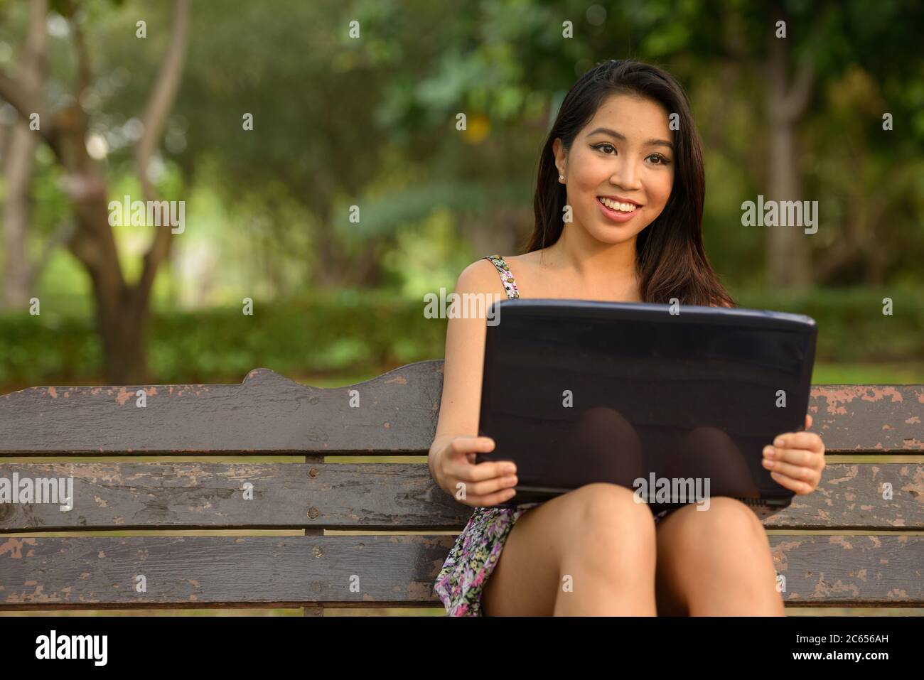 Portrait of young beautiful Asian woman at the park outdoors Stock ...