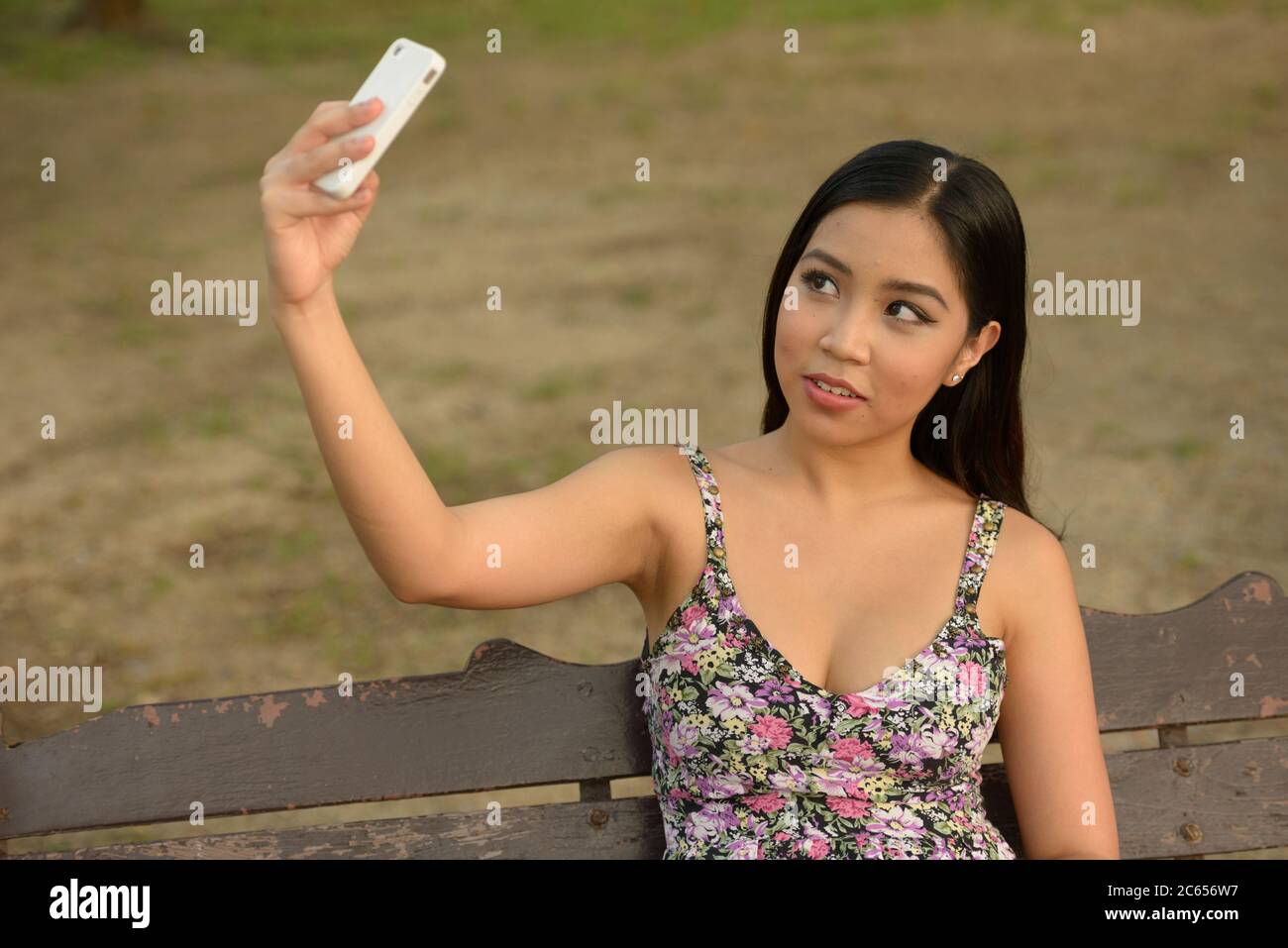 Portrait of young beautiful Asian woman at the park outdoors Stock ...