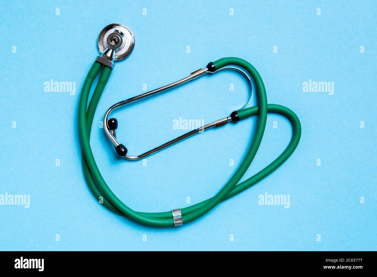 Top view of green medical stethoscope on colorful background with copy ...