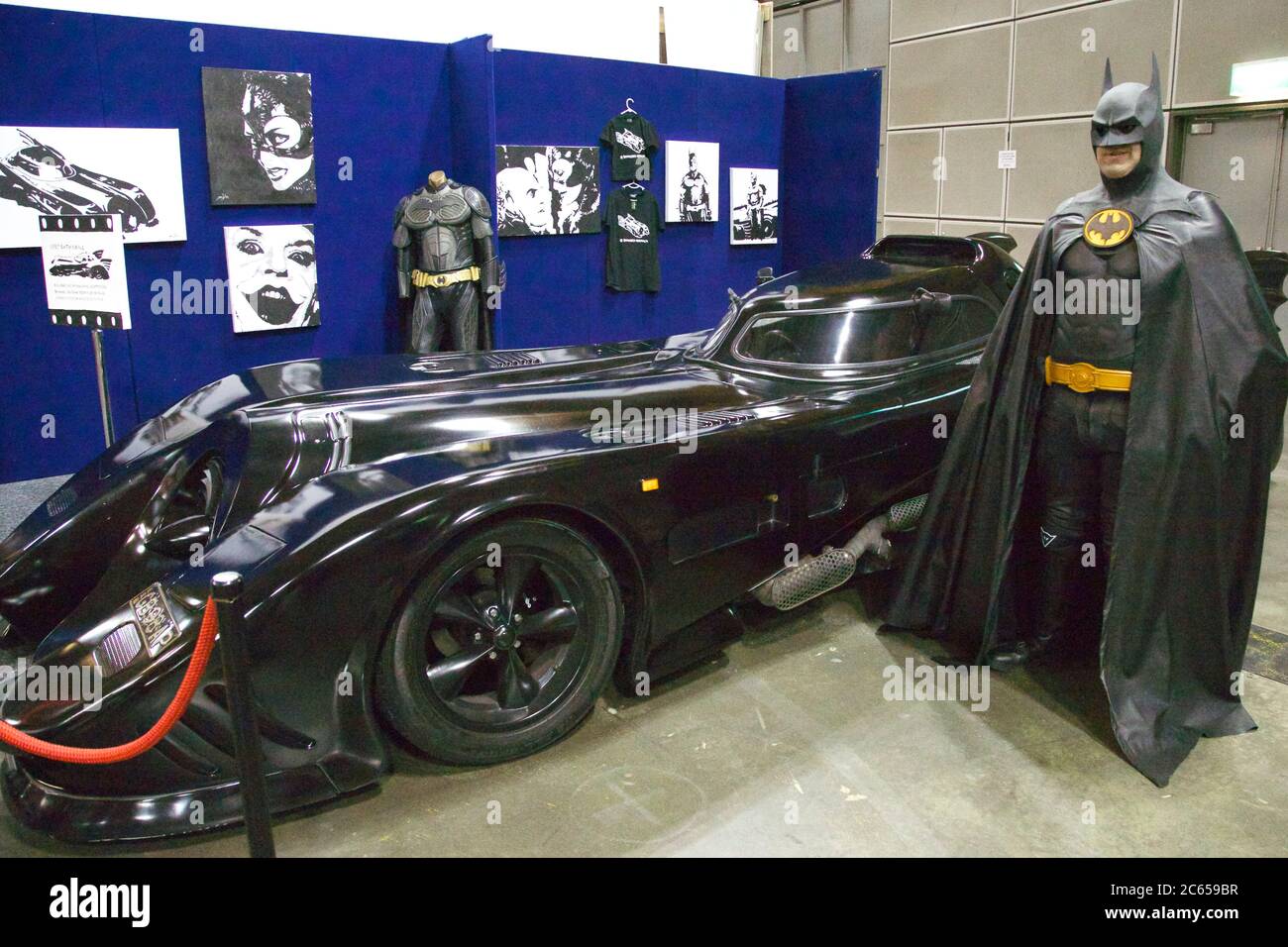 Batman with his car, the Batmobile at the Supanova pop culture expo in