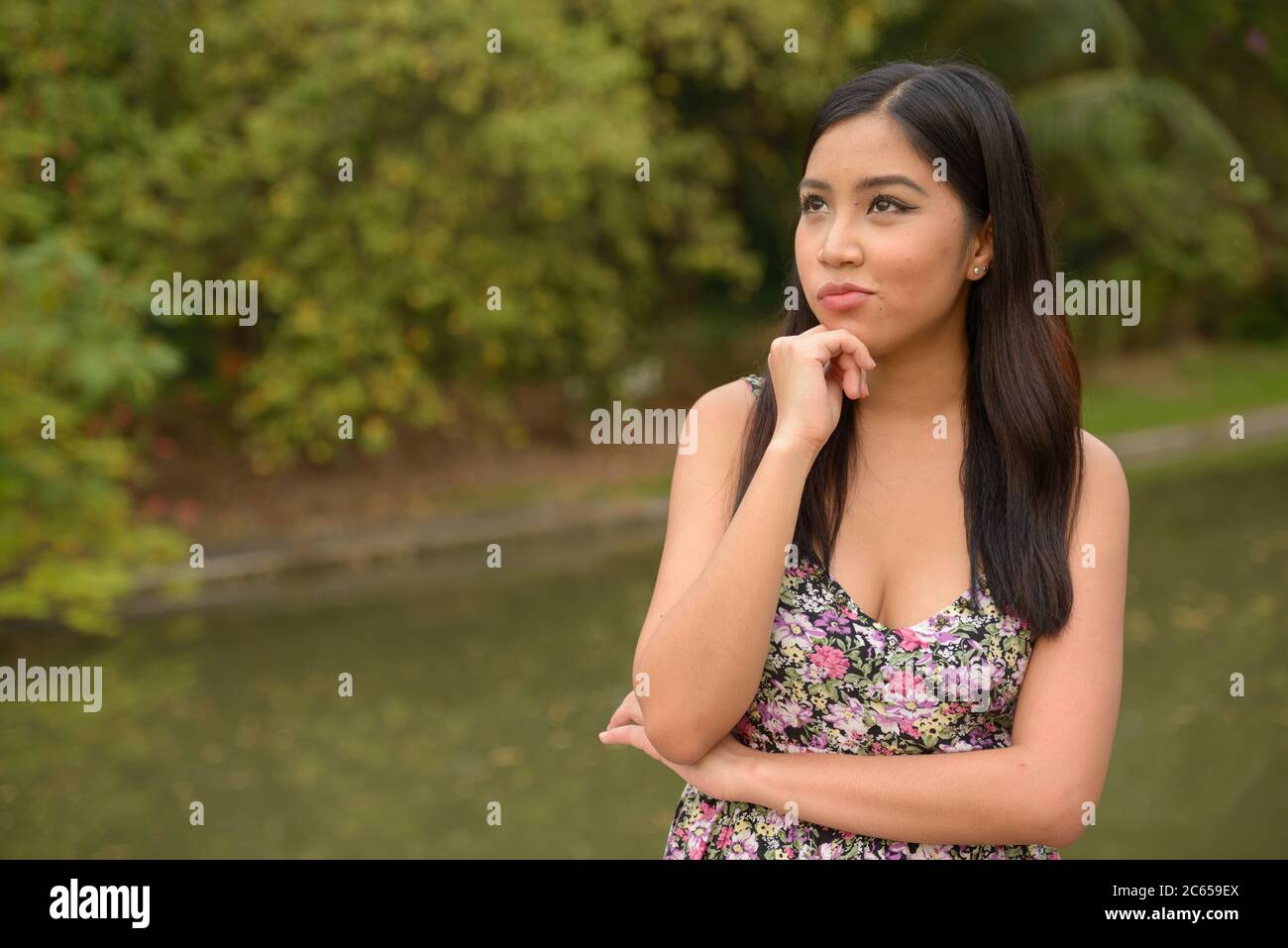Portrait of young beautiful Asian woman at the park outdoors Stock ...