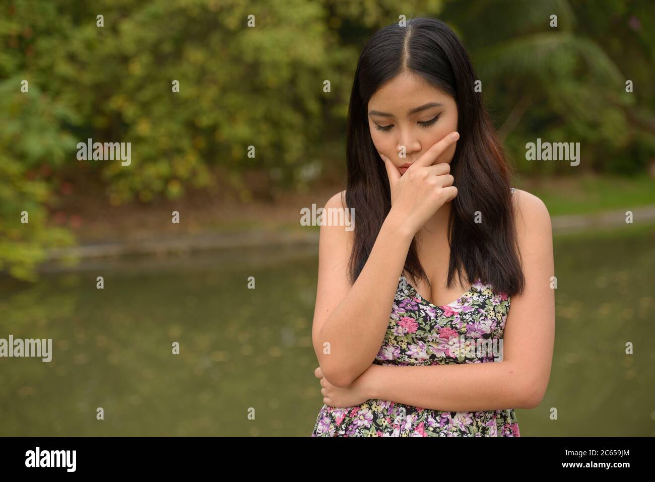 Portrait of young beautiful Asian woman at the park outdoors Stock ...