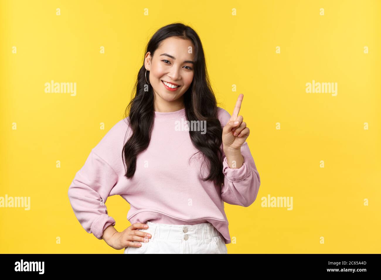 People emotions, lifestyle and fashion concept. Smiling happy good-looking asian  girl giving advice, showing one finger as explain rules, make point Stock  Photo - Alamy