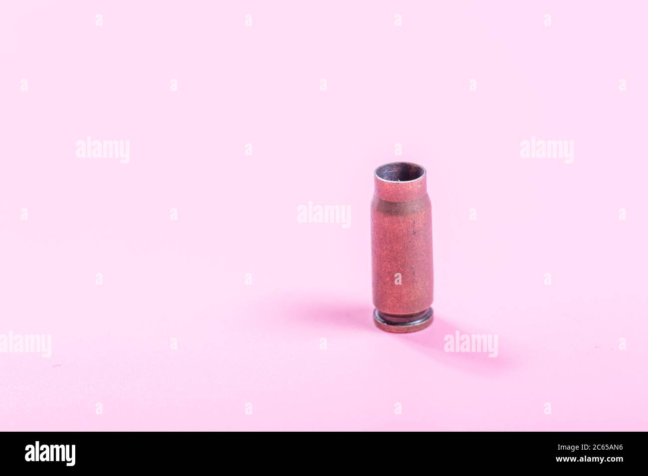 Bullet shell with pink background Stock Photo
