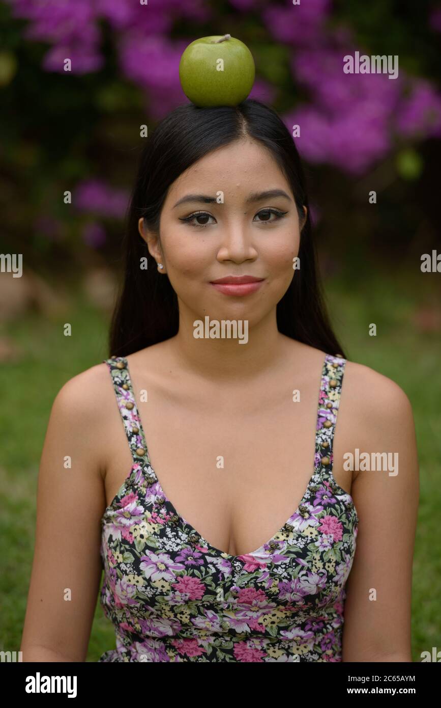 Portrait of young beautiful Asian woman at the park outdoors Stock ...