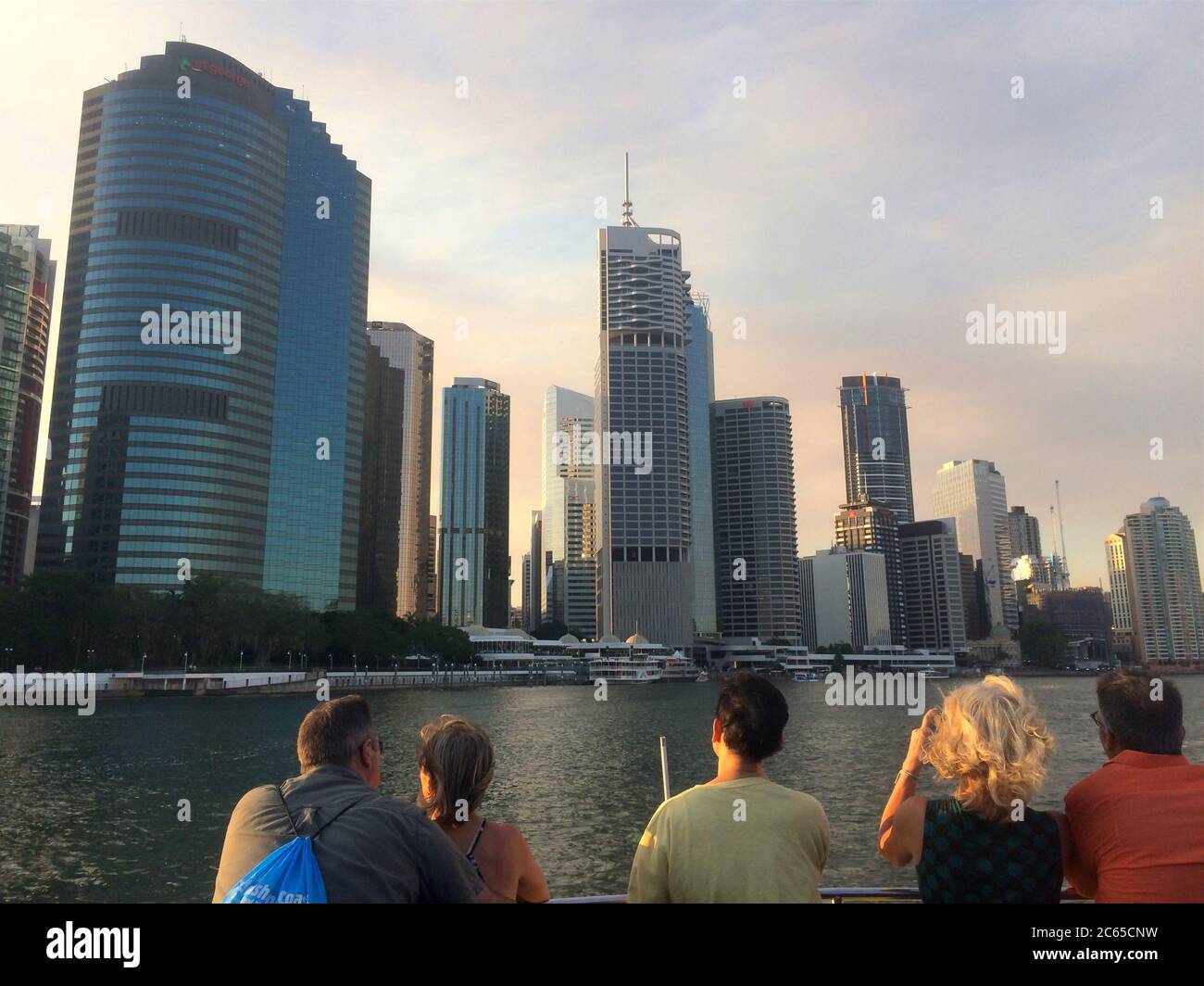 Brisbane, Queensland, Australia - 15th February 2020 : Rear view of some people on the CityCat ferry looking at the city skyline of Brisbane, Australi Stock Photo