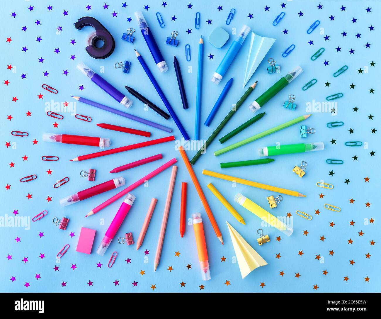 Back to school background with variety of school supplies and star