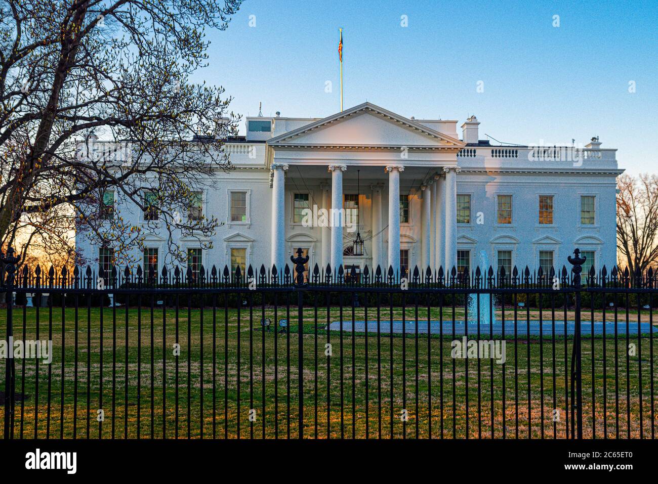 Early morning view of the White House presidential residence and Oval Office in Washington DC with sunrise light on the east side of the building. Stock Photo