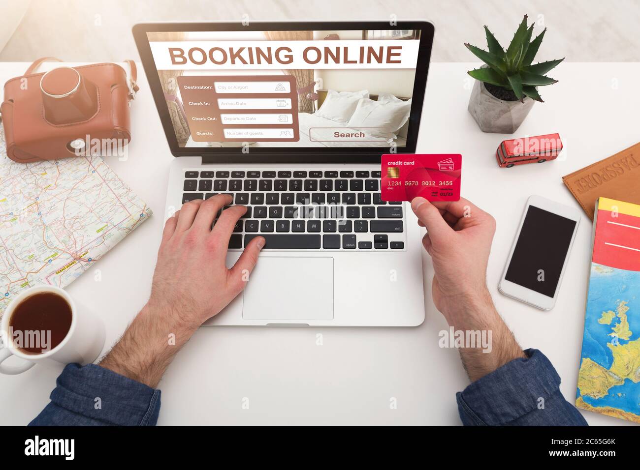 Unrecognizable man making hotel reservation online, using booking website Stock Photo