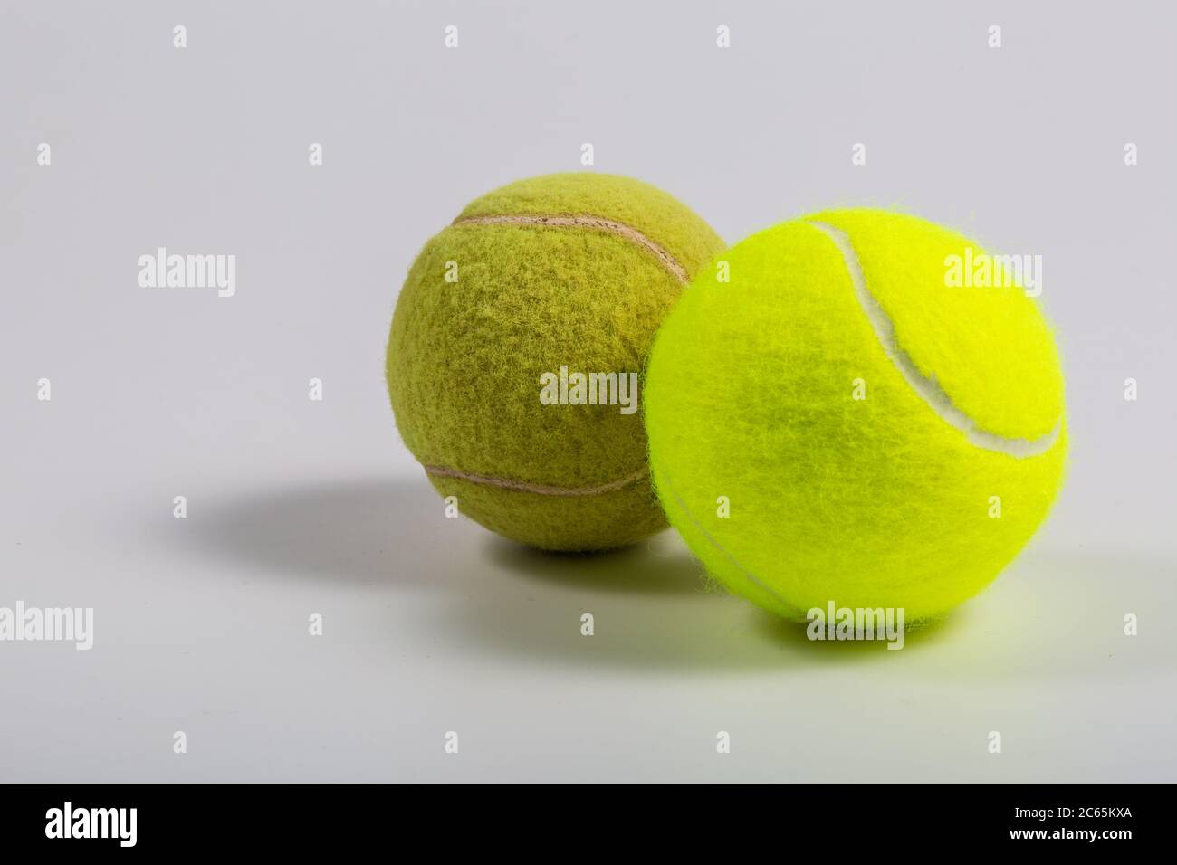 White background, yellowgreen tennis ball closeup Stock Photo Alamy