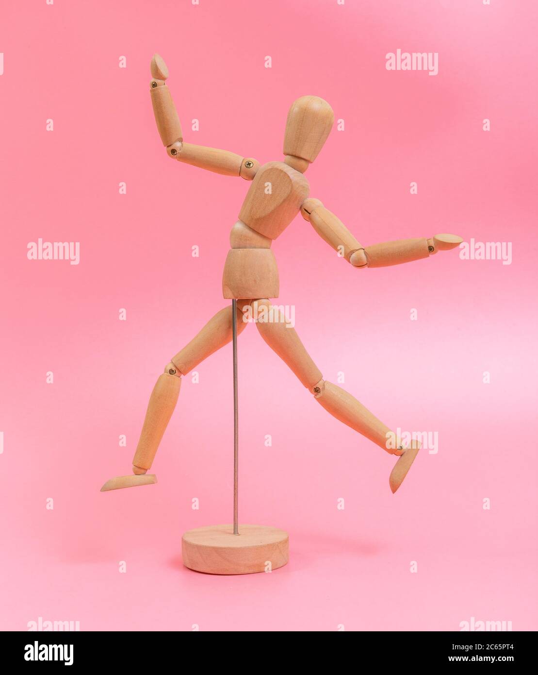 Wood doll on pink background Stock Photo