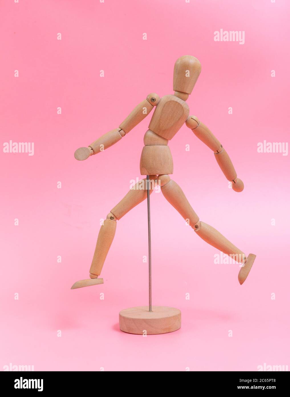 Wood doll on pink background Stock Photo