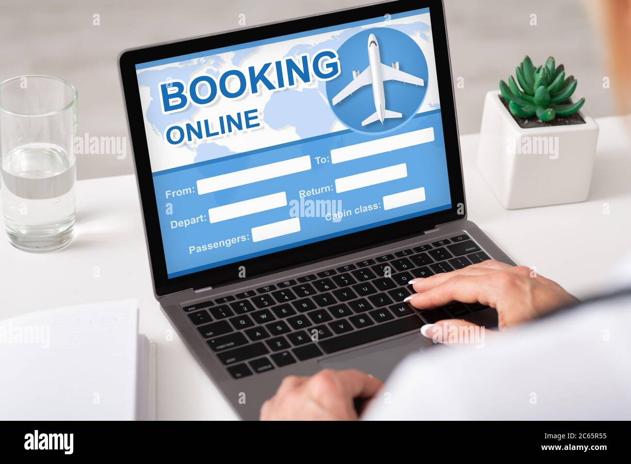 Woman Booking Flight Sitting At Laptop Planning Trip Indoors, Cropped Stock Photo