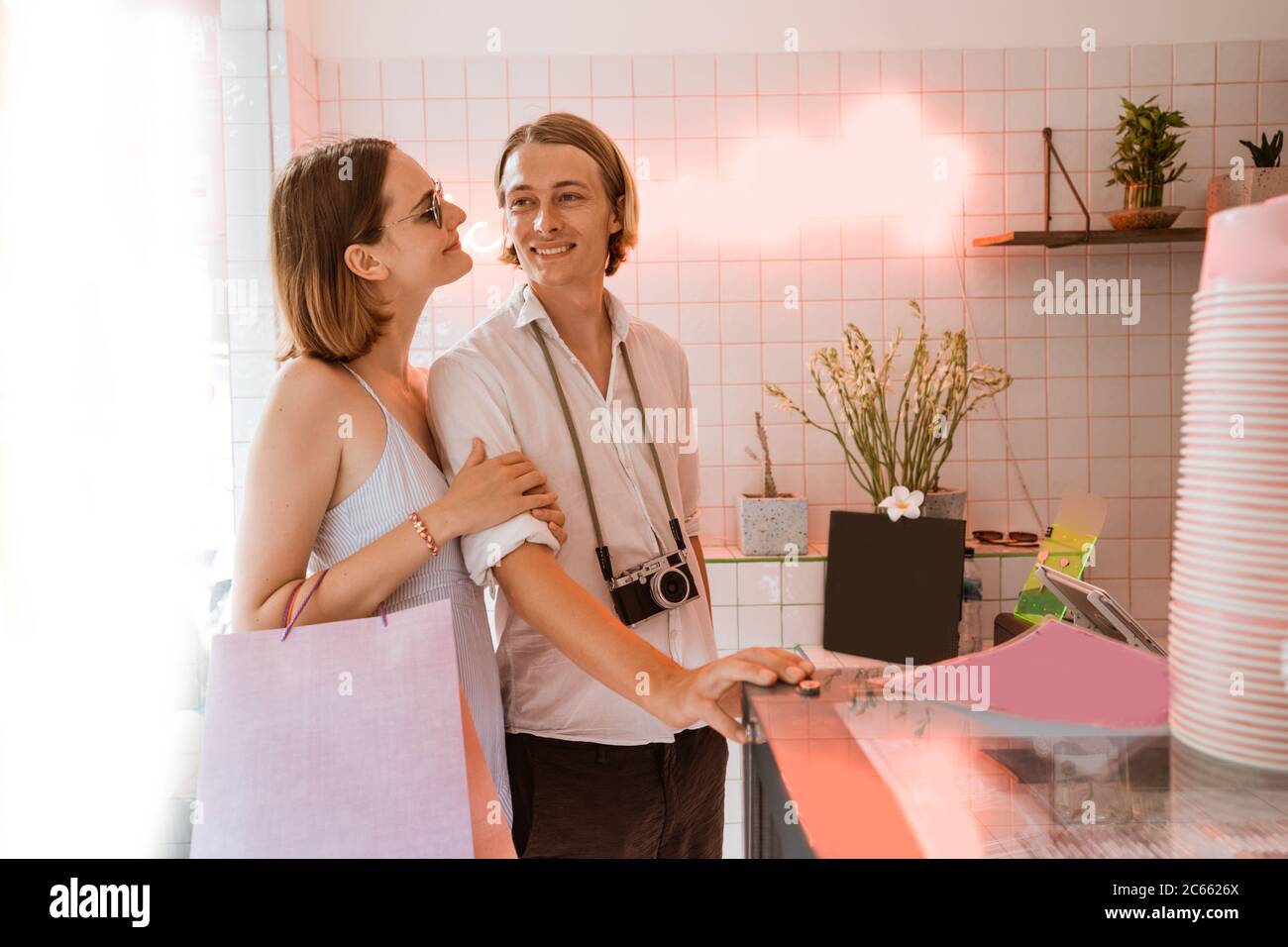 attractive couple on holiday shopping in the shop while traveling Stock Photo