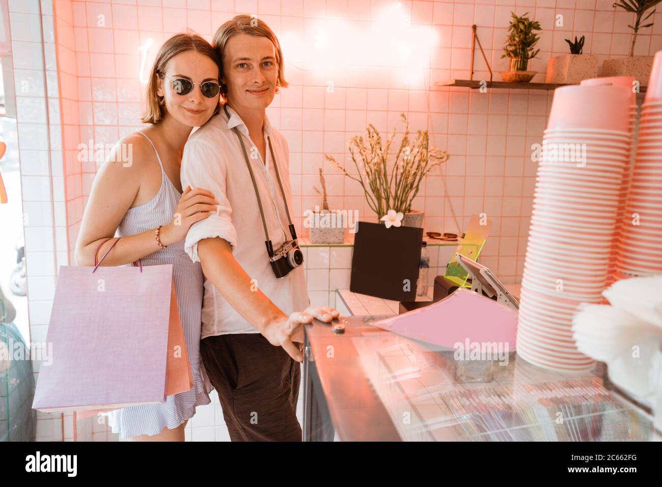 attractive couple on holiday shopping in the shop while traveling Stock Photo