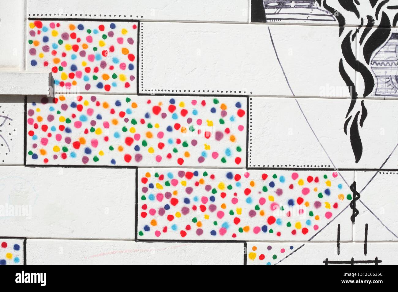 colorfully painted white stone wall, paint splotches, background image