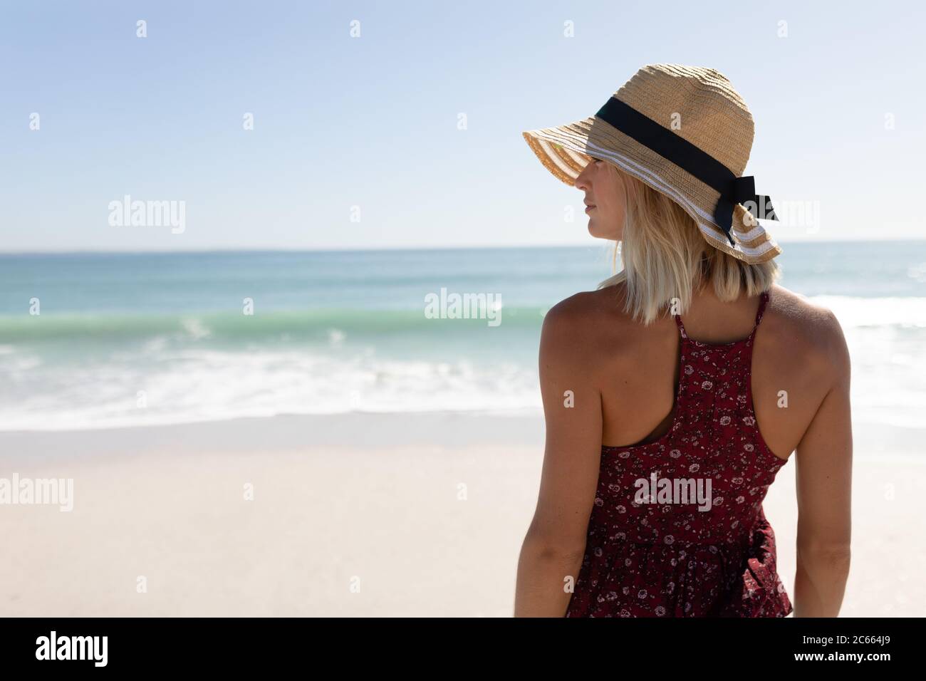 Woman standing wearing hat hi-res stock photography and images - Alamy