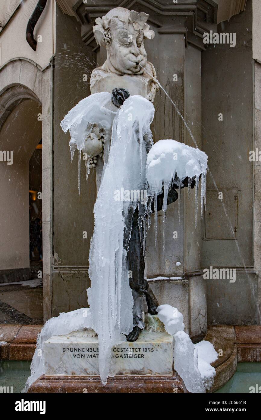 Frozen well with little boy, Munich, Bavaria, Germany Stock Photo