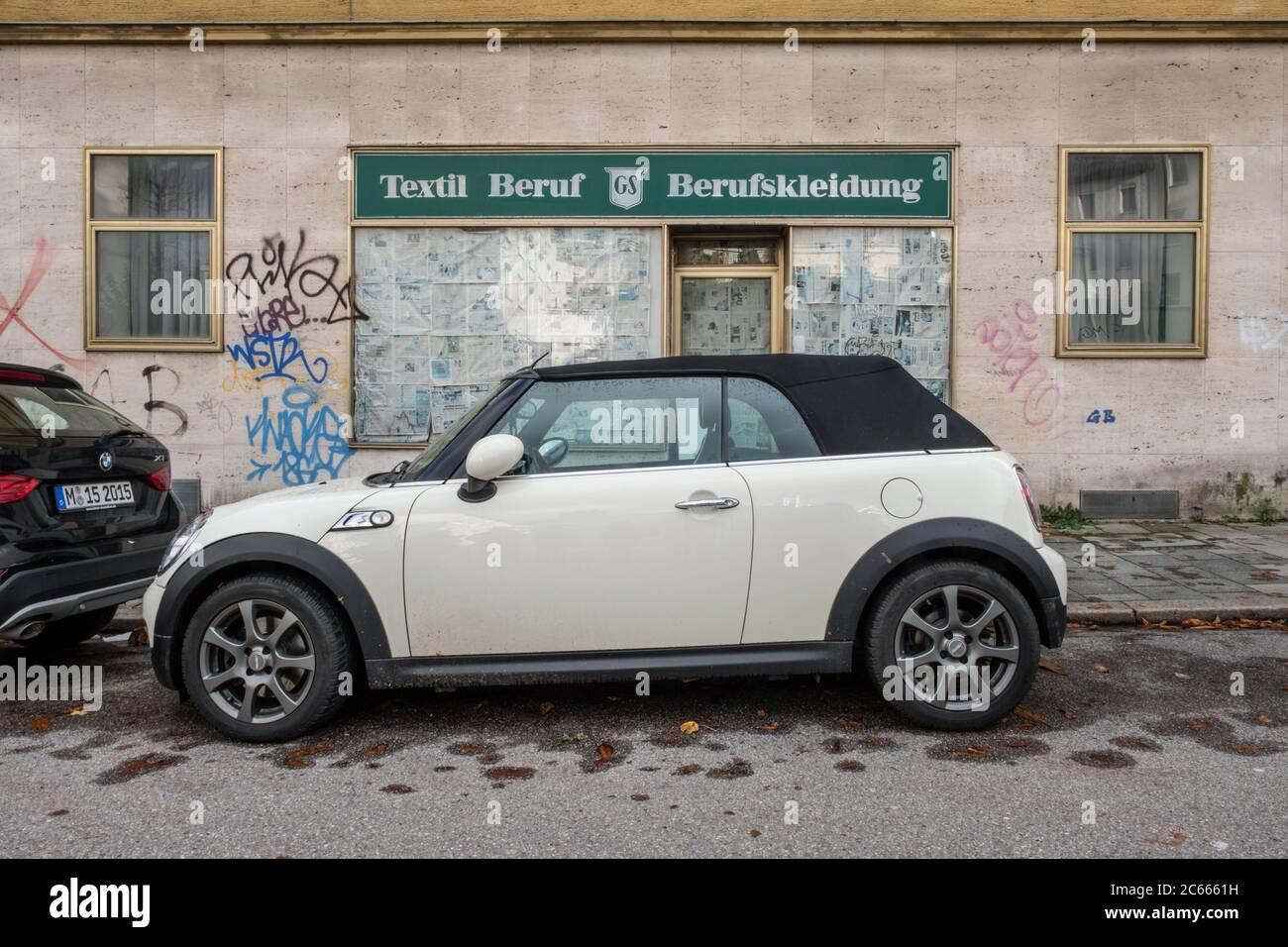 Mini Cooper in front of a closed shop, Munich, Bavaria, Germany Stock Photo